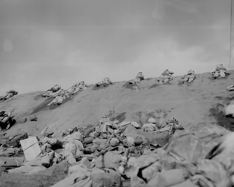 U.S. Marines with the 5th Division inch their way up a slope on Red Beach No. 1 toward Mount Suribachi on Iwo Jima