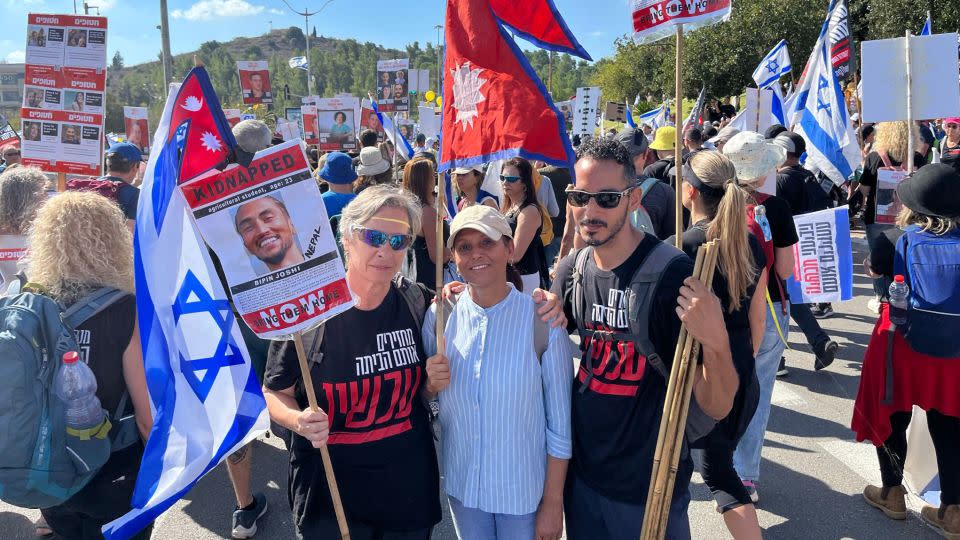 Ada Gansach (left) said she was there to represent the Thai, Nepalese, Filipino and other foreign nationals who were abducted by Hamas in this photo taken November 18 near Jerusalem. - Tara John/CNN