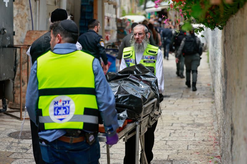 Israeli emergency responders work at the scene of a suspected stabbing attack, according to Israel's ambulance services, in Jerusalem