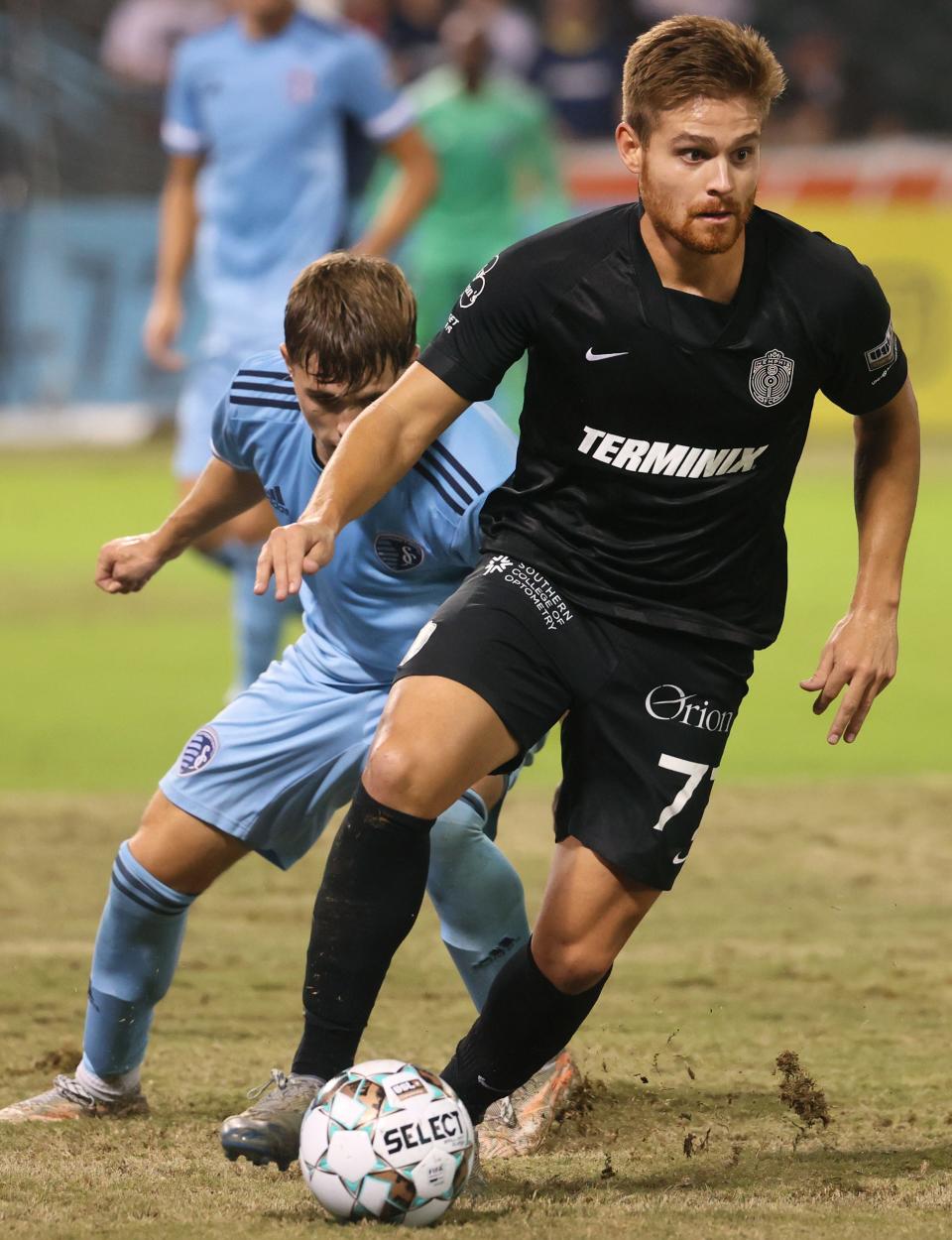 Memphis 901 FC's Alan Winn dribbles the ball down field against Sporting Kansas City II during their match at AutoZone Park on Wednesday, Oct. 6, 2021.