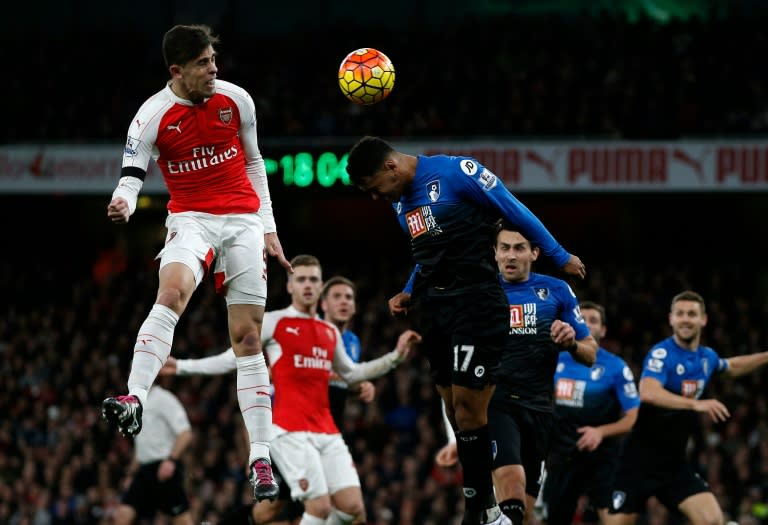 Arsenal's Gabriel (L) jumps for a header during the match against Bournemouth at the Emirates Stadium in London on December 28, 2015