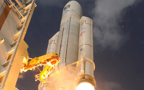 An Ariane 5 rocket containing Galileo staellites blasts off - Credit: STEPHANE CORVAJA