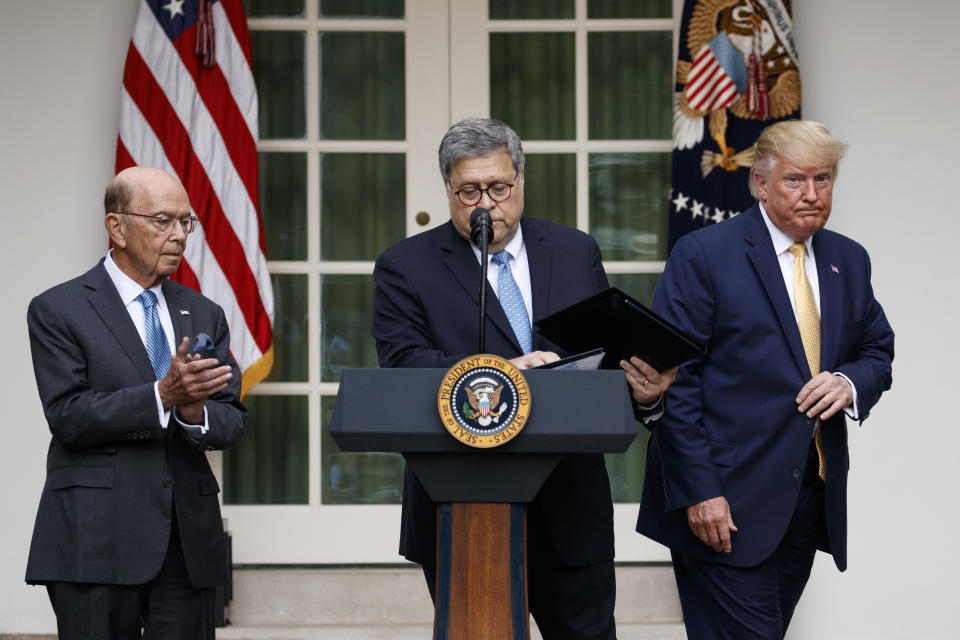 President Donald Trump, joined by Commerce Secretary Wilbur Ross, and Attorney General William Barr, participate in an event about the census and the citizenship question in the Rose Garden at the White House in Washington, Thursday, July 11, 2019. (AP Photo/Carolyn Kaster)
