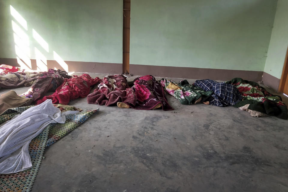 The bodies of the victims killed by airstrikes are shrouded in blankets at a building in Kanan village, Khampat town in Sagaing region on Sunday, Jan.7, 2024. Airstrikes by Myanmar’s military on a village under the control of the pro-democracy resistance in the country’s northwest are reported to have killed at least 17 civilians, including nine children. (AP Photo)