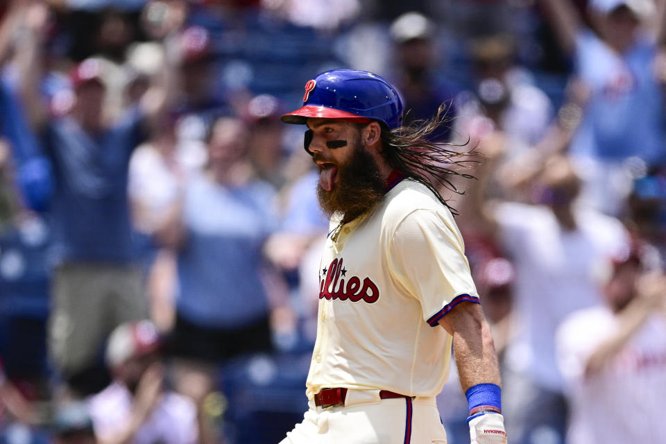 Philadelphia Phillies' Brandon Marsh reacts after scoring on a two-run single hit by David Dahl during the sixth inning of a baseball game against the Arizona Diamondbacks, Sunday, June 23, 2024, in Philadelphia. (AP Photo/Derik Hamilton)