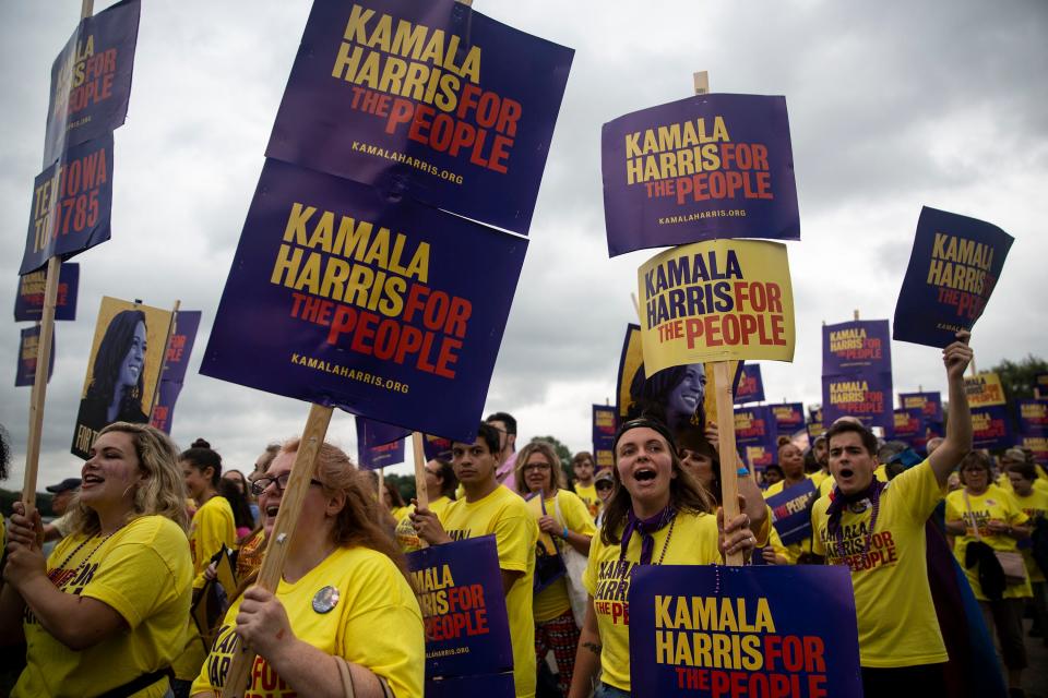 Supporters of U.S. Sen. Kamala Harris, D-CA., march into the Polk County Democrats Steak Fry on Saturday, Sep. 21, 2019, at Water Works Park in Des Moines. 