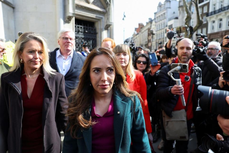 Stella Assange, the wife of WikiLeaks founder Julian Assange walks, outside the High Court on Tuesday (REUTERS)