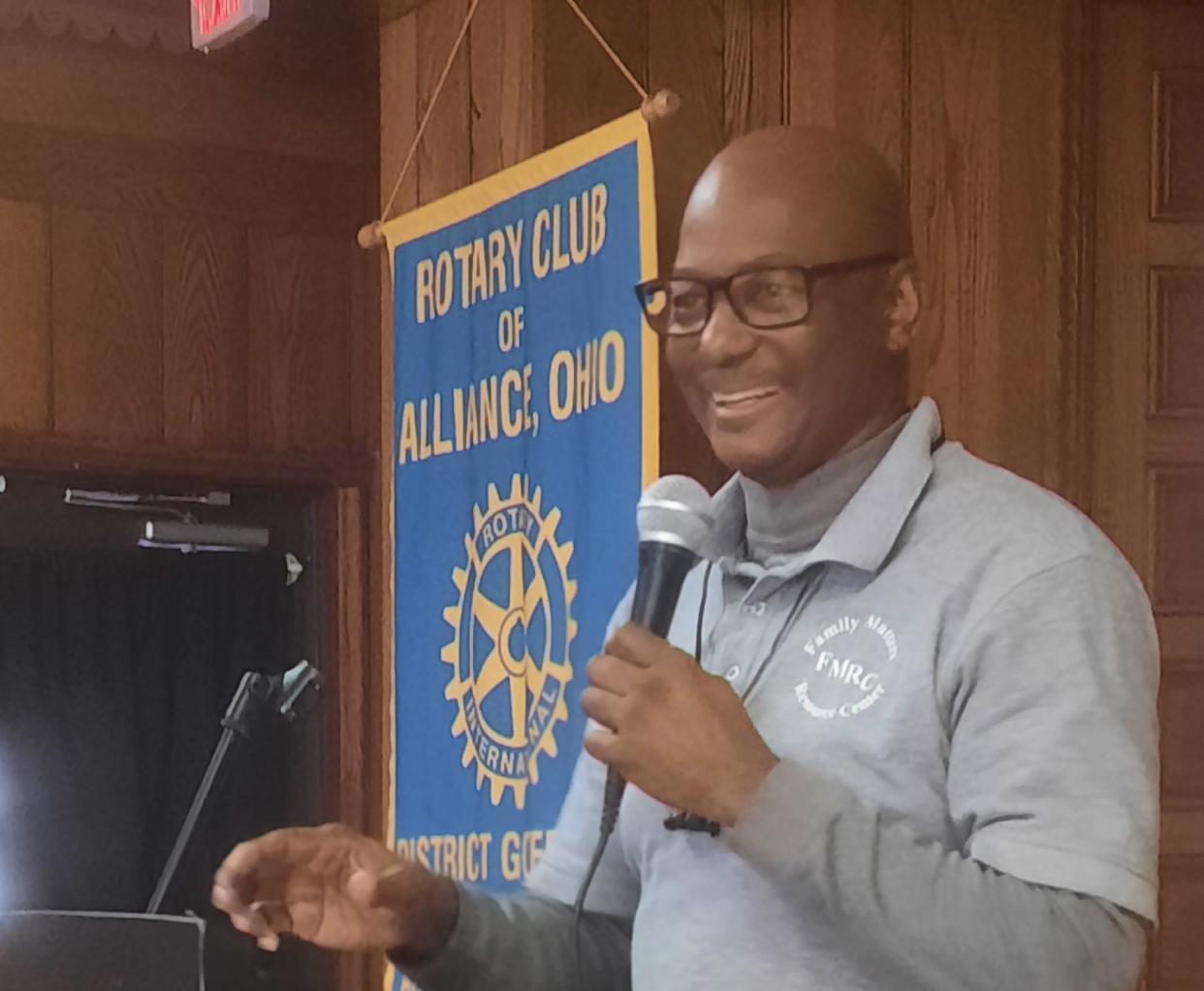 Alliance Rotary Club member Raymont Johnson speaks during a luncheon meeting, sharing details on his church and the Family Matters Resource Center.