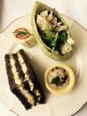 <p>The spread comes with tasty savoury items too - egg salad on rye bread, chicken breast and mustard wrap, eggplant tart and a mini smoked trout wrap. Everything is thoughtfully hand made and service the highest quality.</p>