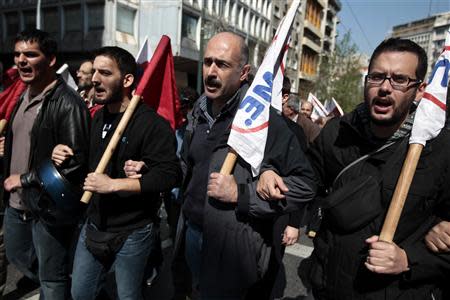 Protesters from the Communist-affiliated trade union PAME shout slogans as they march towards the parliament during a general labour strike in Athens April 9, 2014. REUTERS/Alkis Konstantinidis