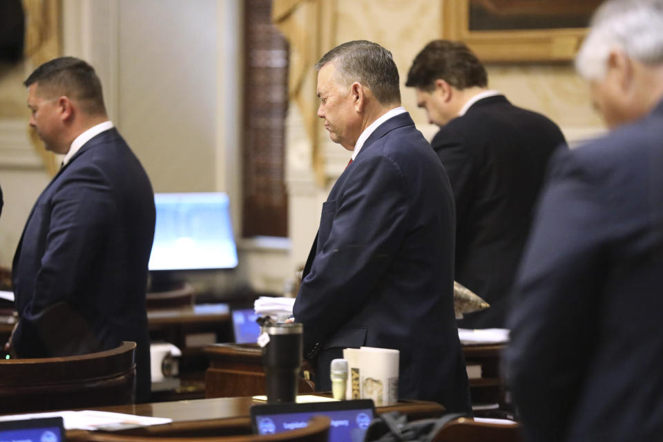 South Carolina Rep. John McCravy, R-Greenwood, prays before the House begins debating an abortion bill on Tuesday, May 16, 2023, in Columbia, South Carolina. (AP Photo/Jeffrey Collins)