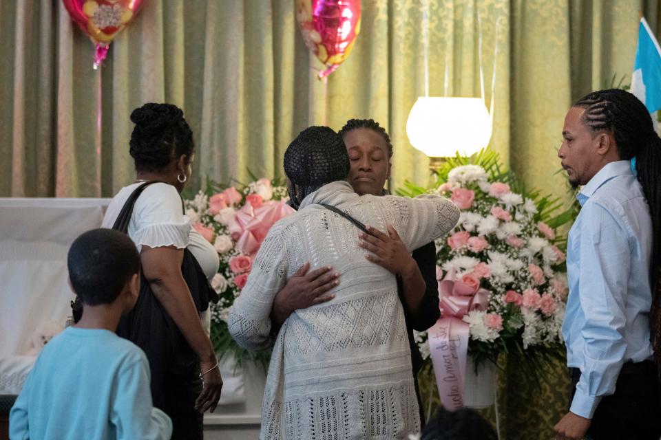 Mabel Alvarez Benedicks, whose 8-year-old daughter died while the family was in Border Patrol custody, greets guests during the wake for  Anadith "Ana" Alvarez on June 16, 2023, in New York.