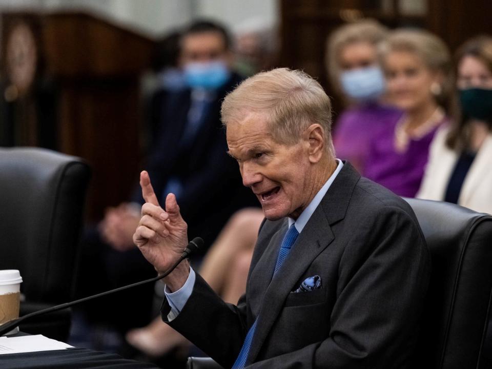 bill nelson points up while testifying to congress into a microphone