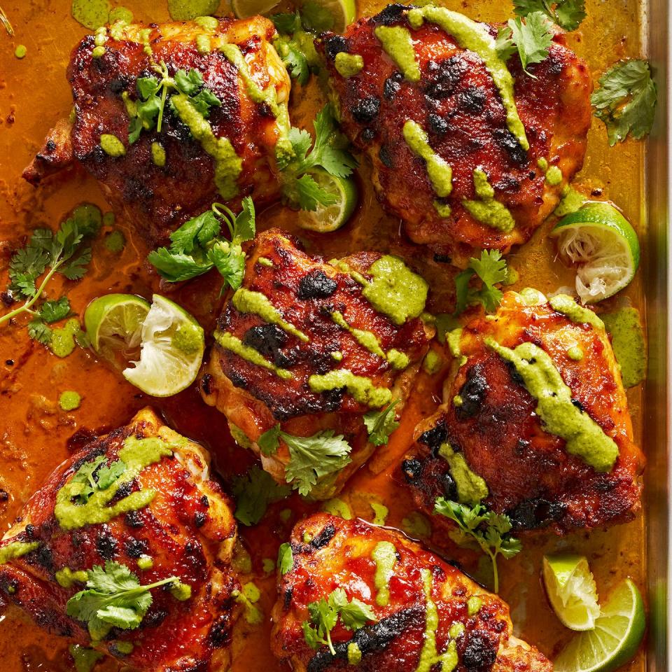 peruvian style chicken drizzled with green sauce and served with lime