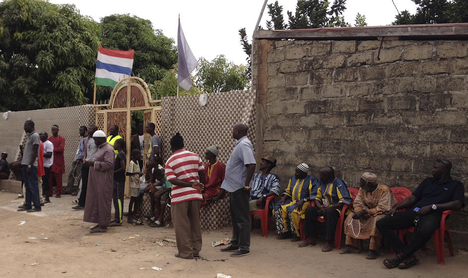 Supporters gather outside Gambia President-elect Adama Barrow's home before he spoke to members of the media in Banjul, Gambia, Saturday, Dec. 10, 2016. Gambia's president-elect said Saturday that the outgoing leader who now rejects his defeat has no constitutional authority to call for another election, and he called on President Yahya Jammeh to help with a smooth transition in the interest of the tiny West African country. (AP Photo/Dawda Bayo)