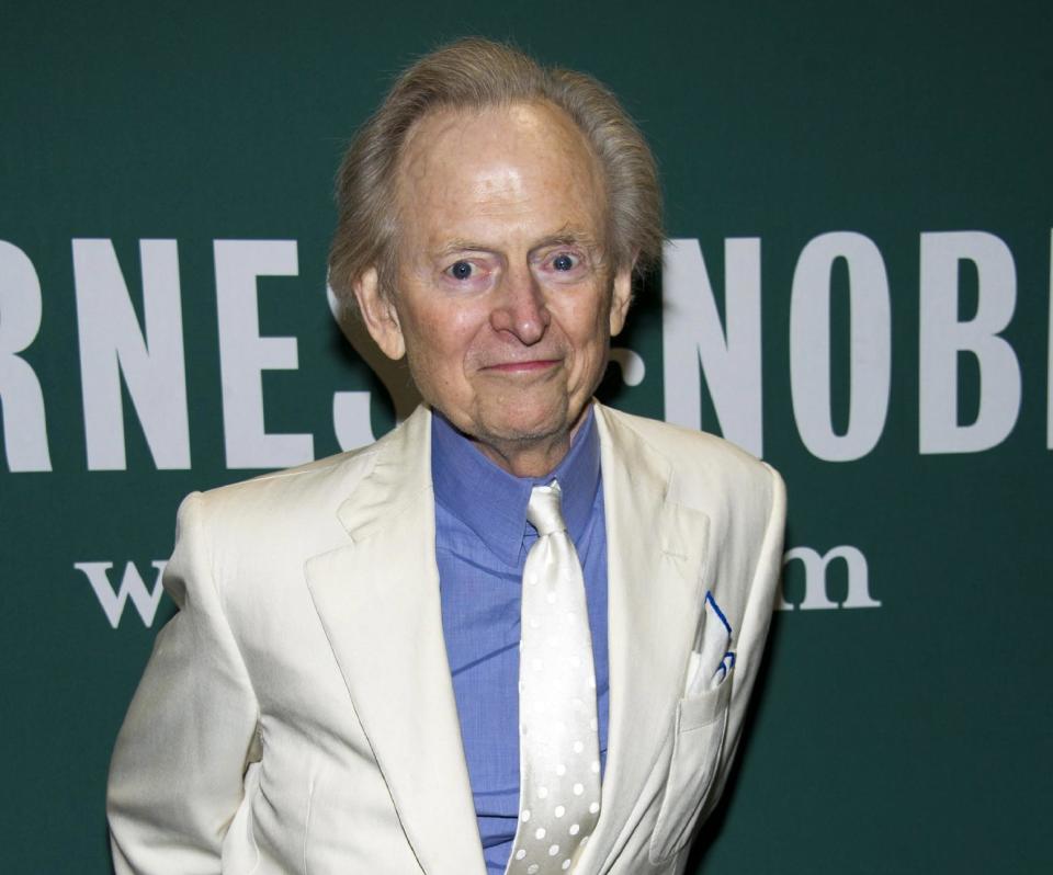 FILE - This Oct. 23, 2012 file photo shows author Tom Wolfe at a book signing for his novel "Back to Blood" at Barnes & Noble in New York. Wolfe's "Back to Blood" came out this fall and he has more fiction and nonfiction planned. "Being an octogenarian is just a hobby of mine," Wolfe, 81, says with a laugh, "something I do at night." (Photo by Charles Sykes/Invision/AP, file)