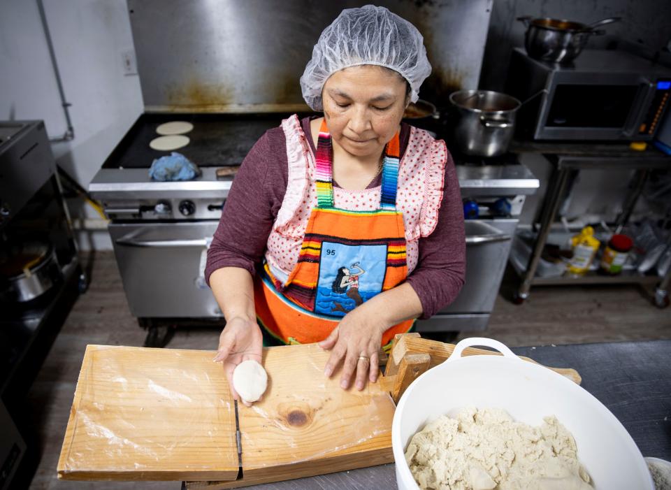 Maria Quiroz presses fresh tortillas at La Cazuela Mexican Restaurant on Friday, March 29, 2024 in Independence, Ore.