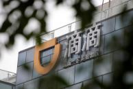 FILE PHOTO: Logo of Didi Chuxing is seen at its headquarters building in Beijing