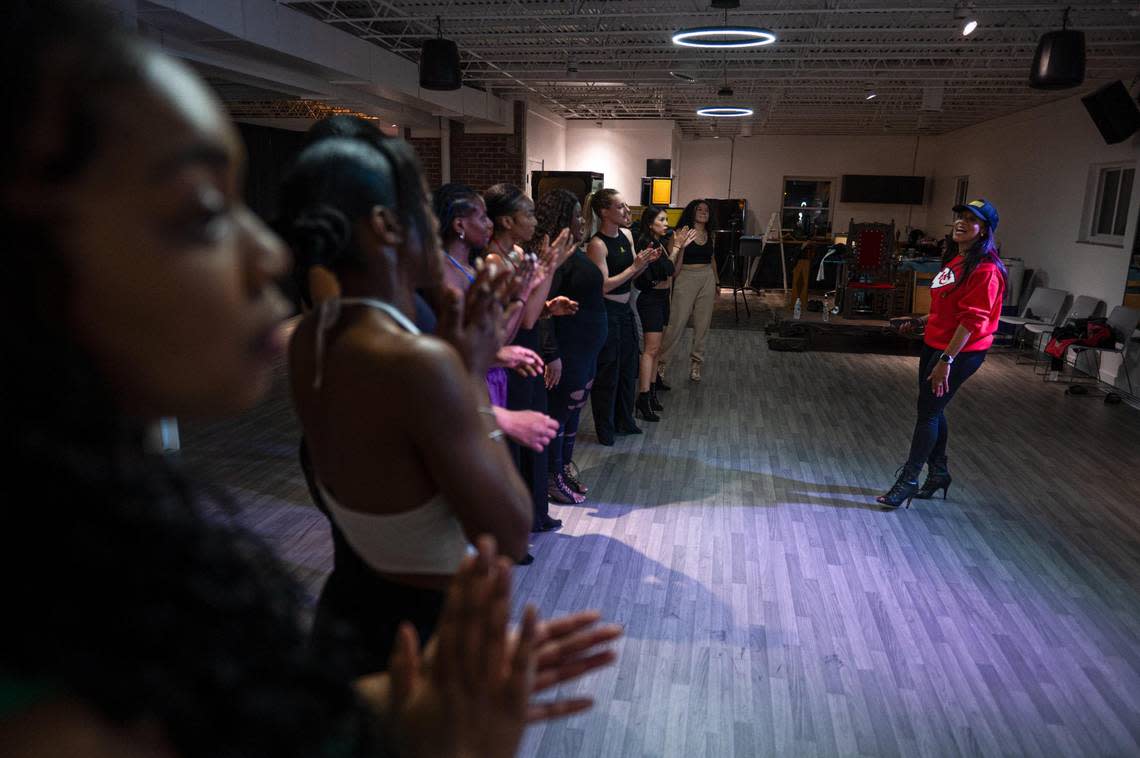 Elaina Paige Thomas, right, speaks with a group of dancers at the end of her class on Wednesday, Sept. 27, 2023, at The Next Paige in Kansas City. “I believe that learning Run the World for all women sets us up for success, for confidence, to rebuild your strength,” Paige Thomas said. “Because at the end of the day, women do run the world.”