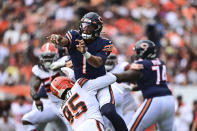Chicago Bears quarterback Justin Fields (1) is hit by Chicago Bears defensive tackle Khyiris Tonga (95) after a pass during the second half of an NFL football game, Sunday, Sept. 26, 2021, in Cleveland. (AP Photo/David Dermer)
