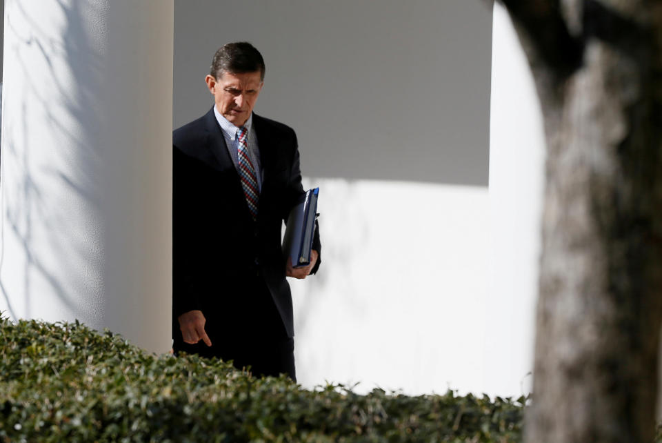 FILE PHOTO - White House National Security Advisor Michael Flynn walks down the White House colonnade on the way to Japanese Prime Minister Shinzo Abe and U.S. President Donald Trump's joint news conference at the White House in Washington, U.S., February 10, 2017. REUTERS/Jim Bourg/File Photo