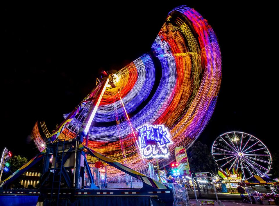 Screams could be heard coming from the 'Freak Out' ride in the Thrill Ville area of the 2019 Kentucky State Fair. Aug. 15, 2019