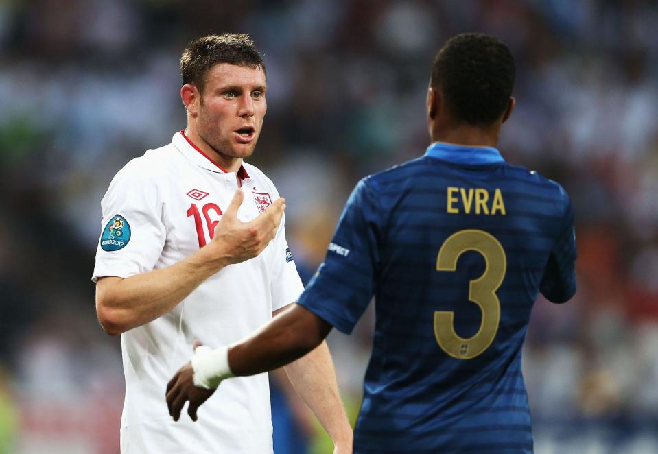 James Milner of England speaks to Patrice Evra of France during the UEFA EURO 2012 group D match between France and England at Donbass Arena on June 11, 2012 in Donetsk, Ukraine.