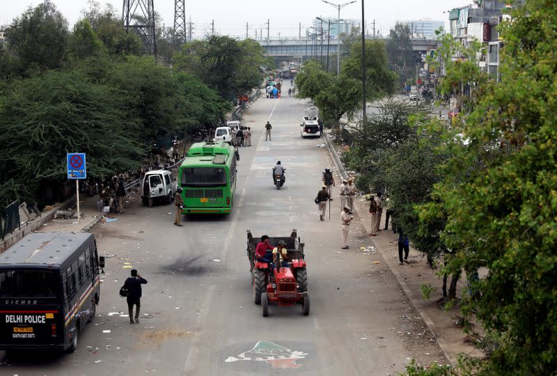 Police stand guard after they cleared the site of the longest-running protest against a new citizenship law following the lockdown by Delhi state government, in New Delhi