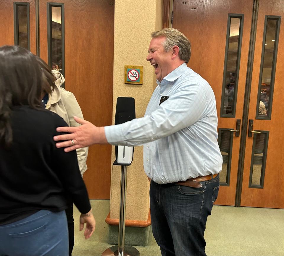 Redding Planning Commission chair Aaron Hatch talks to supporters after the City Council on Tuesday, May 7, 2024, decided not to dismiss him from the community advisory board.