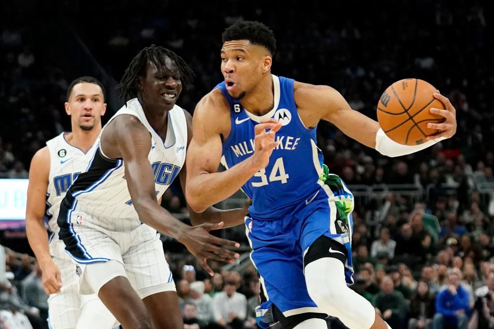 Milwaukee Bucks' Giannis Antetokounmpo drives against Orlando Magic's Bol Bol during the second half of an NBA basketball game Wednesday, March 1, 2023, in Milwaukee. (AP Photo/Aaron Gash)