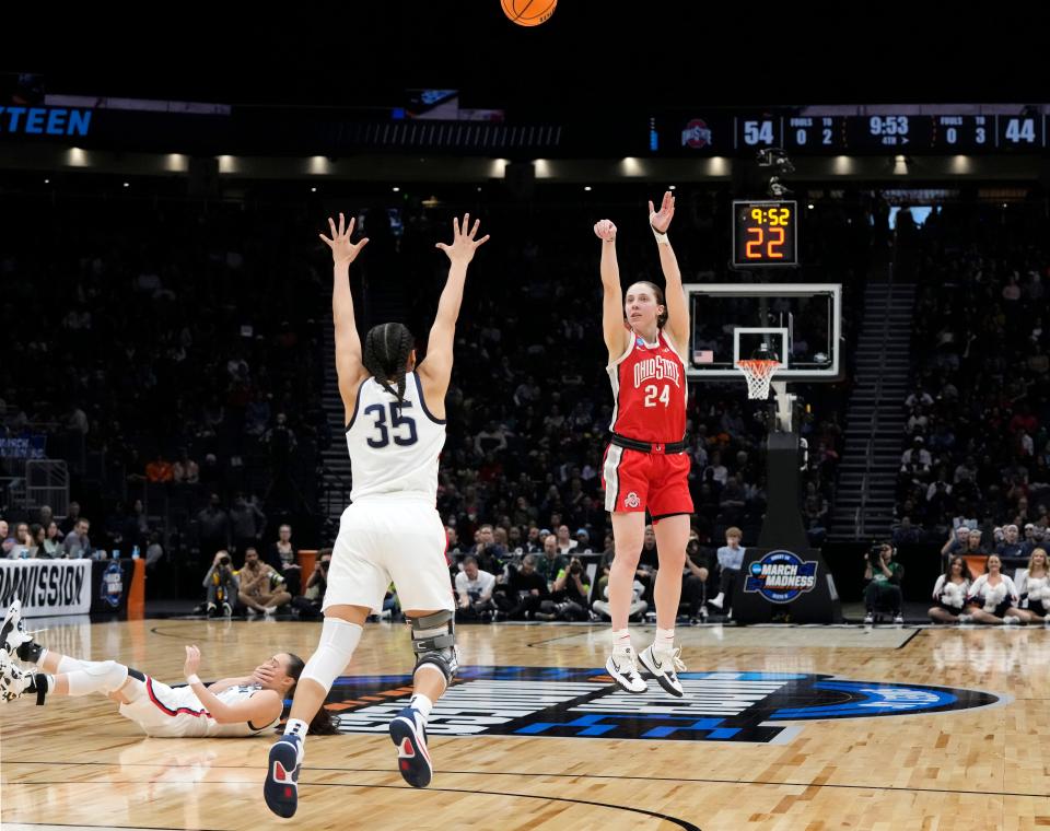 March 25, 2023; Seattle, WA, USA; Ohio State Buckeyes guard Taylor Mikesell (24) takes a three-point shot while guarded by UConn Huskies guard Azzi Fudd (35) during the second half of an NCAA Tournament Sweet Sixteen game against at Climate Pledge Arena in Seattle on Saturday. Ohio State won the game 73-61.Mandatory Credit: Barbara J. Perenic/Columbus Dispatch