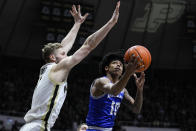 New Orleans guard Marquez Cooper (10) shoots around Purdue forward Caleb Furst during the first half of an NCAA college basketball game in West Lafayette, Ind., Wednesday, Dec. 21, 2022. (AP Photo/Michael Conroy)