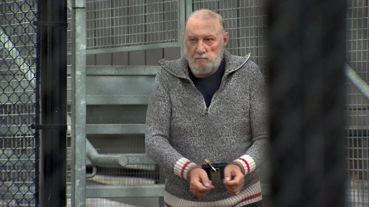 Former priest Eric Dejaeger leaves the Nunavut Court of Justice in Iqaluit on June 8, 2023 after a brief court appearance. He was granted bail on Tuesday afternoon. (David Gunn/CBC  - image credit)