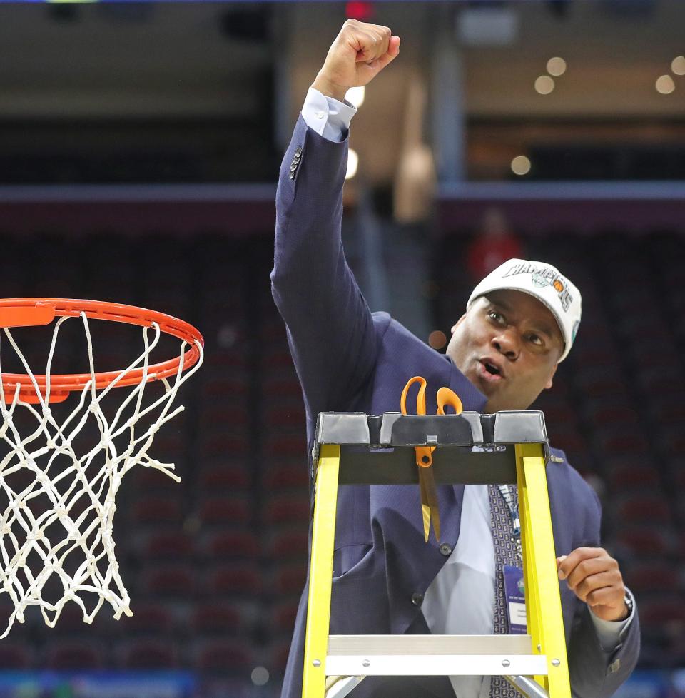 University of Akron Athletic Director Charles Guthrie celebrates the Zips' 75-55 win over Kent State in the Mid American Conference championship game Saturday at Rocket Mortgage FieldHouse. [Phil Masturzo/ Beacon Journal]