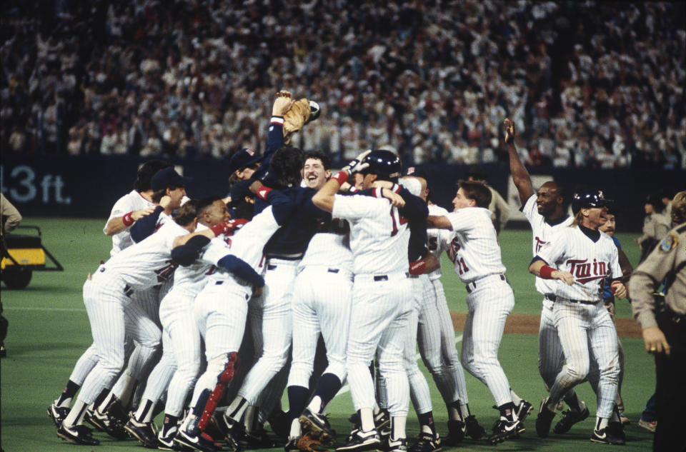 MINNEAPOLIS, MN - OCTOBER 27:  Members of the Minnesota Twins celebrate defeating the Atlanta Braves in Game 7 of the 1991 World Series on the field at Hubert. H. Humphrey Metrodome on Sunday, October 27, 1991 in Minneapolis, Minnesota. (Photo by MLB via Getty Images) 