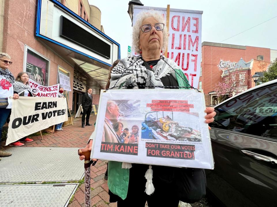 Nancy Wein, with Richmonders for Peace in Israel-Palestine, demonstrates in support of ceasefire in Gaza amid the conflict between Hamas and Israel outside of Sen. Kaine's campaign event in downtown Richmond, Virginiam Tuesday.