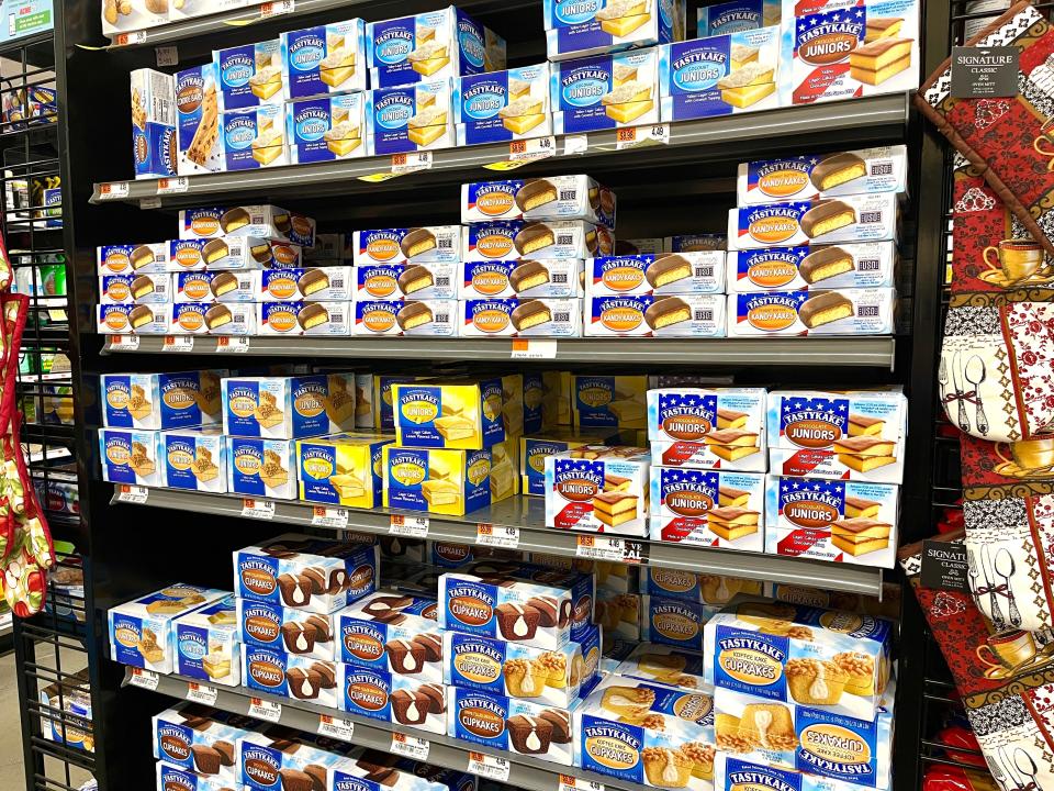 Boxes of different Tastykake snacks lining the shelves at an ACME