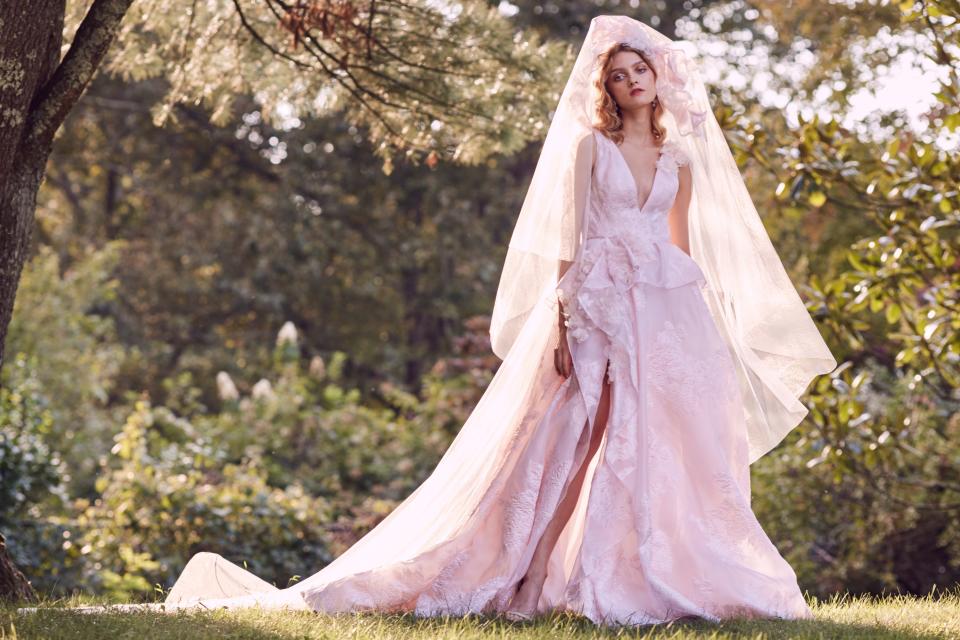 From over-the-top feathers to breezy caftans, these are the trends defining Fall 2019 bridal.