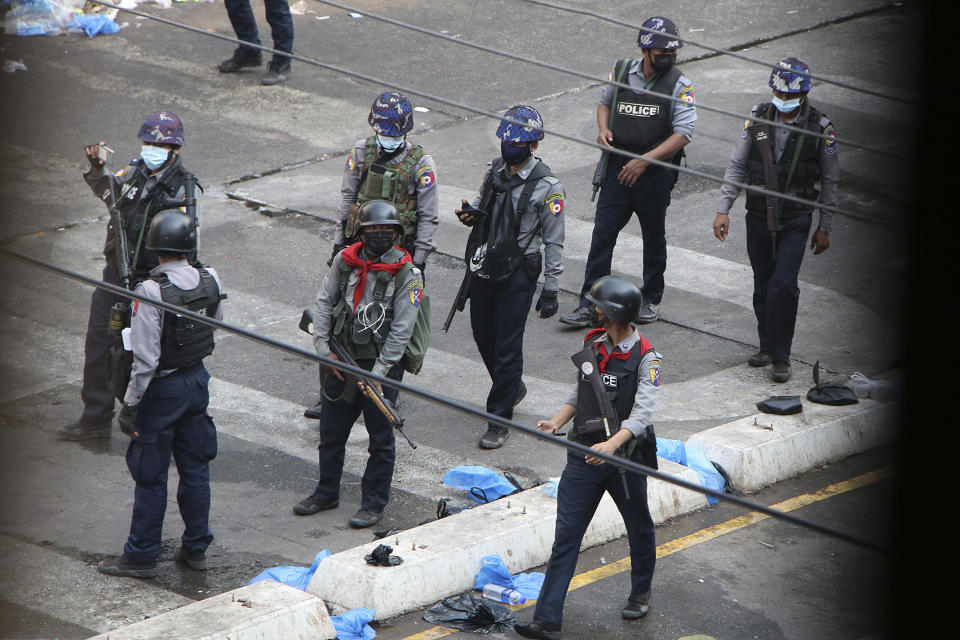 FILE - Police patrol the streets in Yangon, Myanmar, Saturday, March 13, 2021. The prospects for peace in Myanmar, much less a return to democracy, seem dimmer than ever two years after the army seized power from the elected government of Aung San Suu Kyi, experts say. (AP Photo, File)