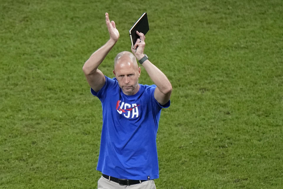 head coach Gregg Berhalter of the United States applauds at the end of the World Cup round of 16 soccer match between the Netherlands and the United States, at the Khalifa International Stadium in Doha, Qatar, Saturday, Dec. 3, 2022. The Netherlands won 3-1. (AP Photo/Luca Bruno)