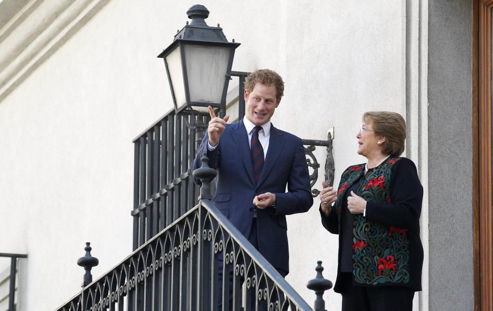 Britain's Prince Harry speaks with Chile's President Bachelet during a meeting in Santiago
