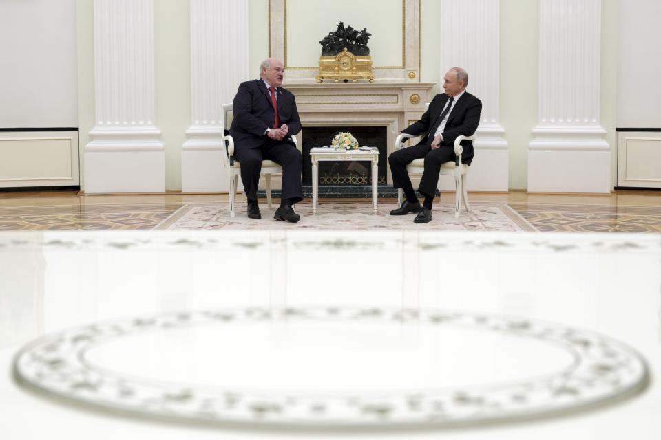 Russian President Vladimir Putin, right, and Belarus President Alexander Lukashenko talk to each other during their meeting at the Kremlin in Moscow, Russia, Thursday, April 11, 2024. (Gavriil Grigorov, Sputnik, Kremlin Pool Photo via AP)