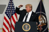 U.S. President Donald Trump delivers remarks at the National Republican Congressional Committee March Dinner in Washington, U.S., March 21, 2017. REUTERS/Carlos Barria