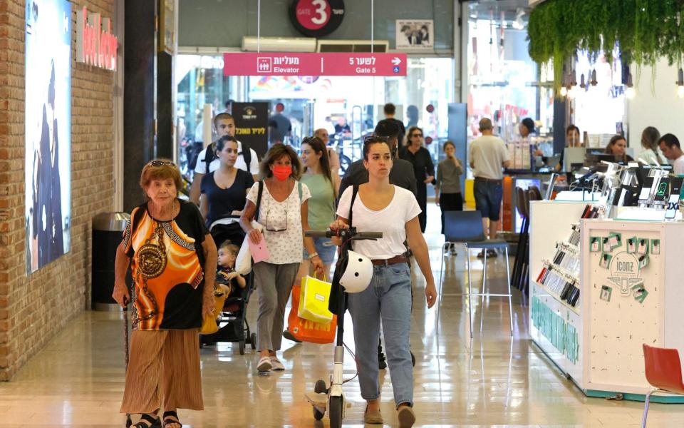 Maskless shoppers at Dizengoff shopping centre in Tel Aviv on June 15 2021 - Jack Guez/AFP