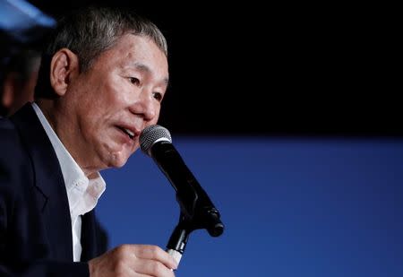 Japanese director Takeshi Kitano speaks as he receives the "SAMURAI" award during the closing ceremony of the Tokyo International Film Festival in Tokyo October 31, 2014. REUTERS/Yuya Shino