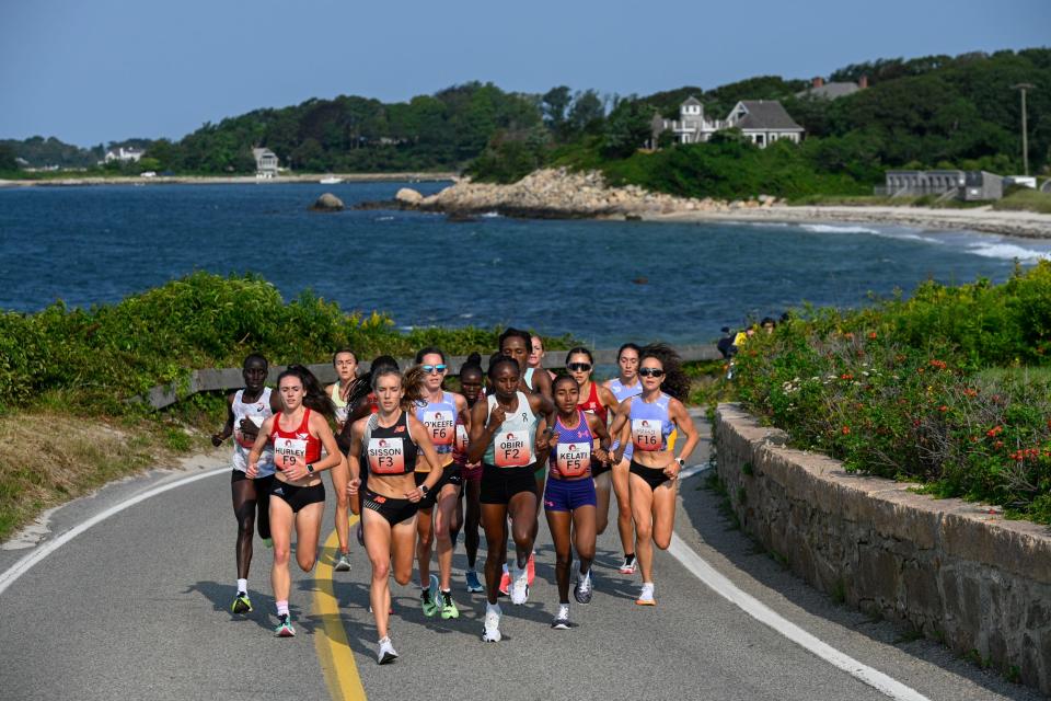 The elite women runners round the corner approaching Nobska Lighthouse at the 51st running of the Falmouth Road Race on Sunday.
