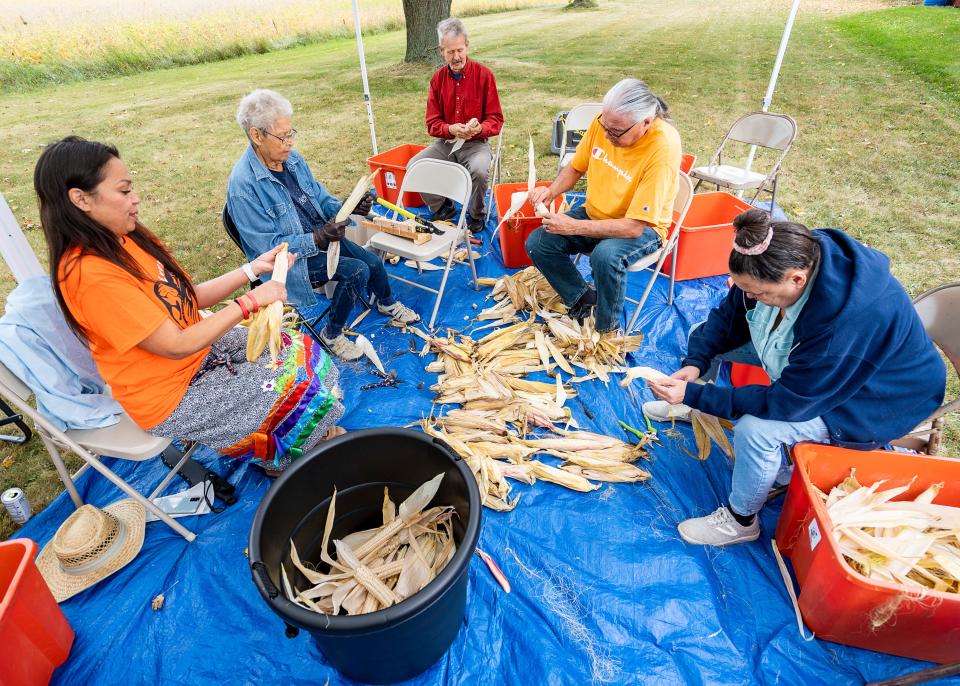 Community members participate in the Yeyathókwas Wahnitale (Harvest Moon), a multigenerational event to gather, pick, husk, and braid corn together as a community, on Sept. 30.