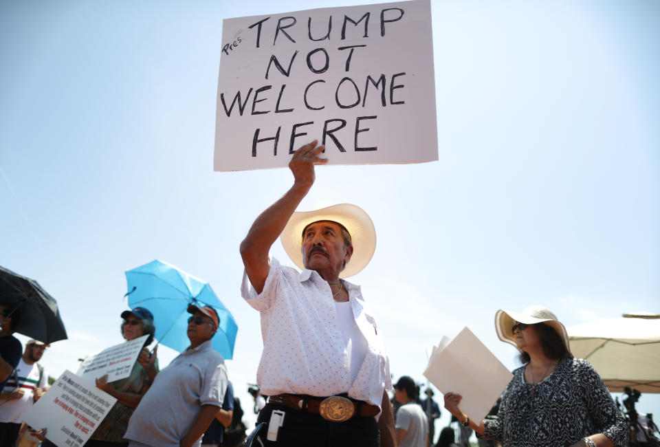 Miguel de Anda, born and raised in El Paso, holds a sign reading 'Trump Not Welcome Here' at a protest against President Trump's visit following a mass shooting, which left at least 22 people dead, on Aug. 7, 2019 in El Paso, Texas. (Photo: Mario Tama/Getty Images)