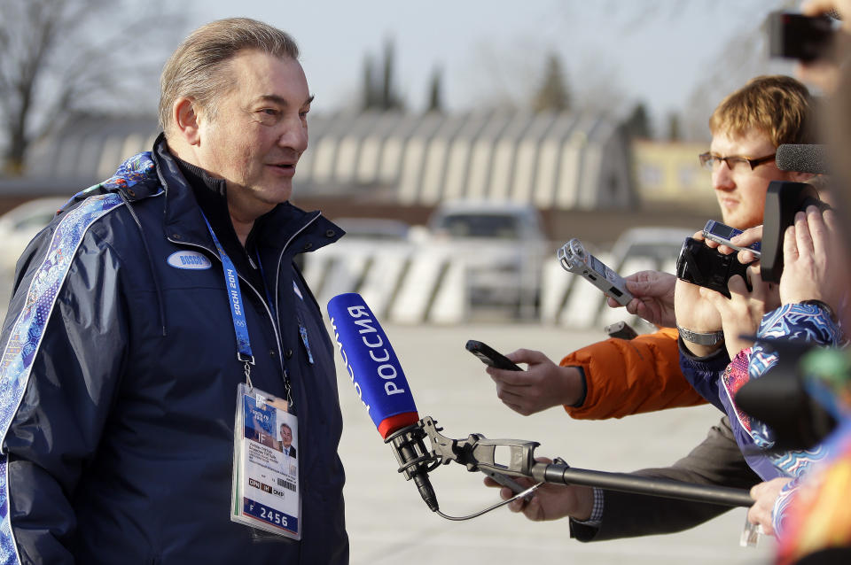 Vladislav Tretiak, a former goaltender for Russia's national ice hockey team, talks with reporters at the Sochi International Airport where NHL hockey players are arriving for the 2014 Winter Olympics, Monday, Feb. 10, 2014, in Sochi, Russia. (AP Photo/Mark Humphrey)