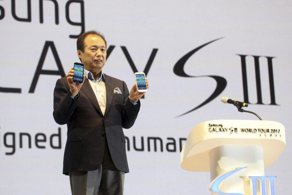 In this photo released by Samsung Electronics Co., Shin Jong-kyun, president of Samsung's mobile communications business, poses with Samsung Electronics' newest smartphone Galaxy S III during its world tour in Seoul, South Korea, Monday, June 25, 2012. Samsung Electronics, the world's top mobile phone maker, said Monday it expects global sales of the latest Galaxy smartphone to surpass 10 million in July even as it struggles to keep up with demand because of component shortages. (AP Photo/Samsung Electronics) NO SALES